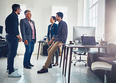 Buy stock photo Shot of a group of designers having a discussion at work