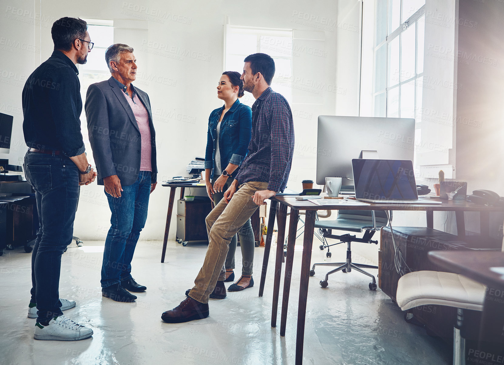 Buy stock photo Shot of a group of designers having a discussion at work