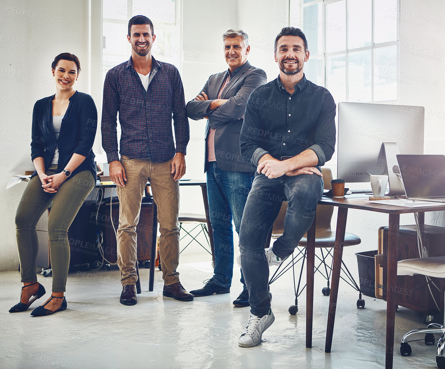 Buy stock photo Portrait of a team of creative workers standing together in an office