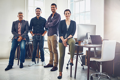 Buy stock photo Portrait of a team of creative workers standing together in an office