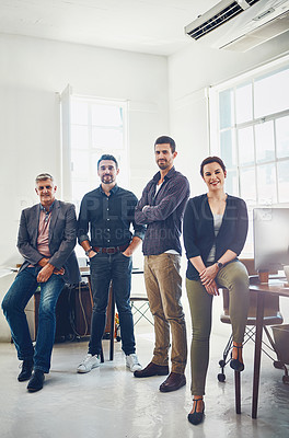 Buy stock photo Portrait of a team of creative workers standing together in an office