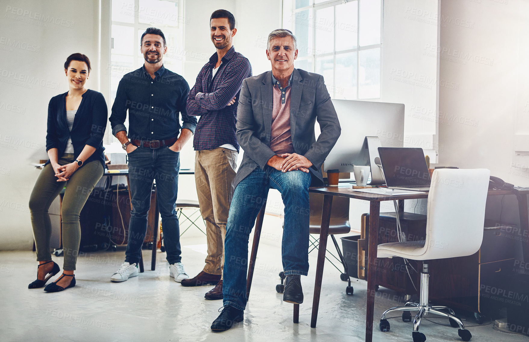 Buy stock photo Portrait of a team of creative workers standing together in an office