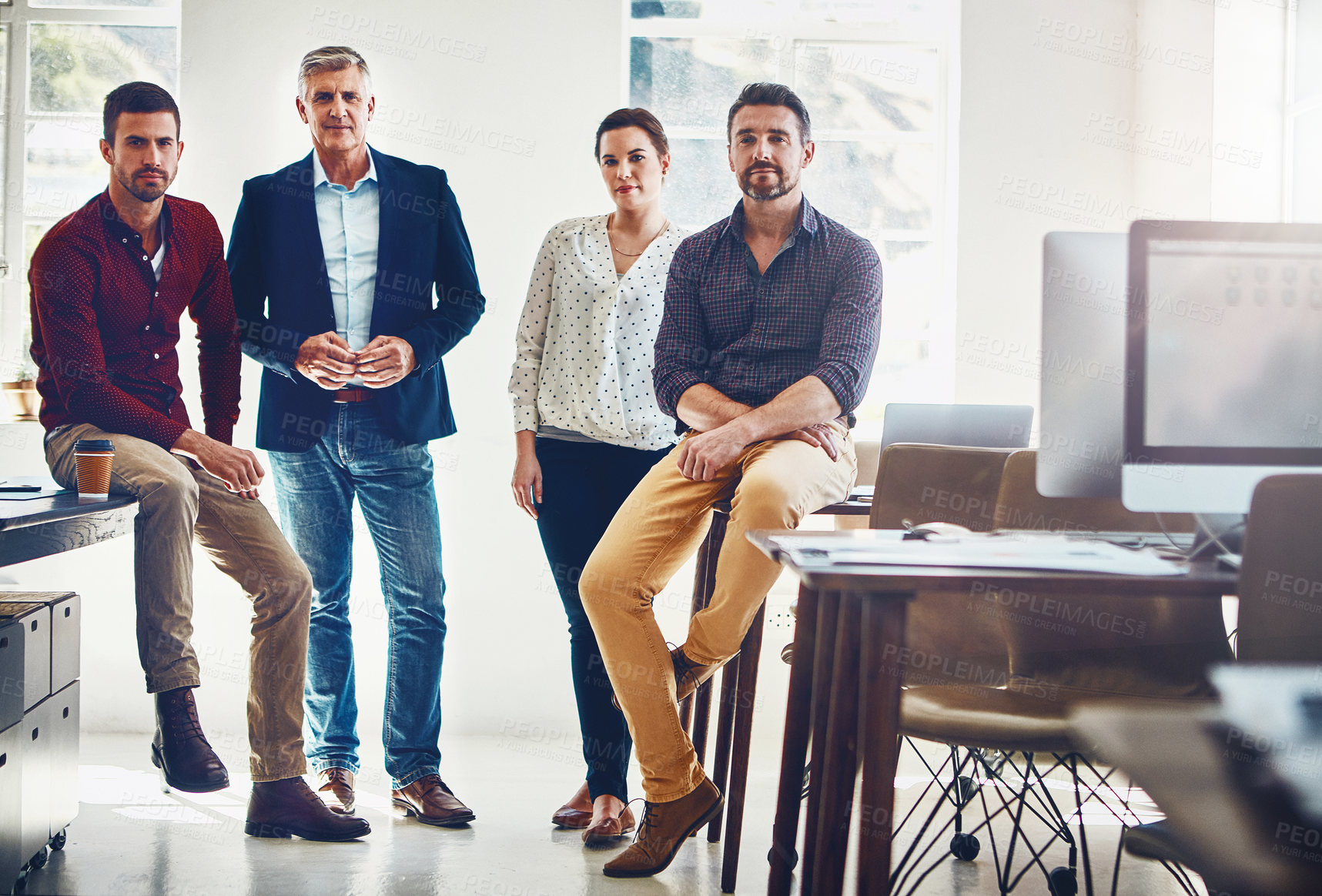 Buy stock photo Portrait of a team of creative workers standing together in an office