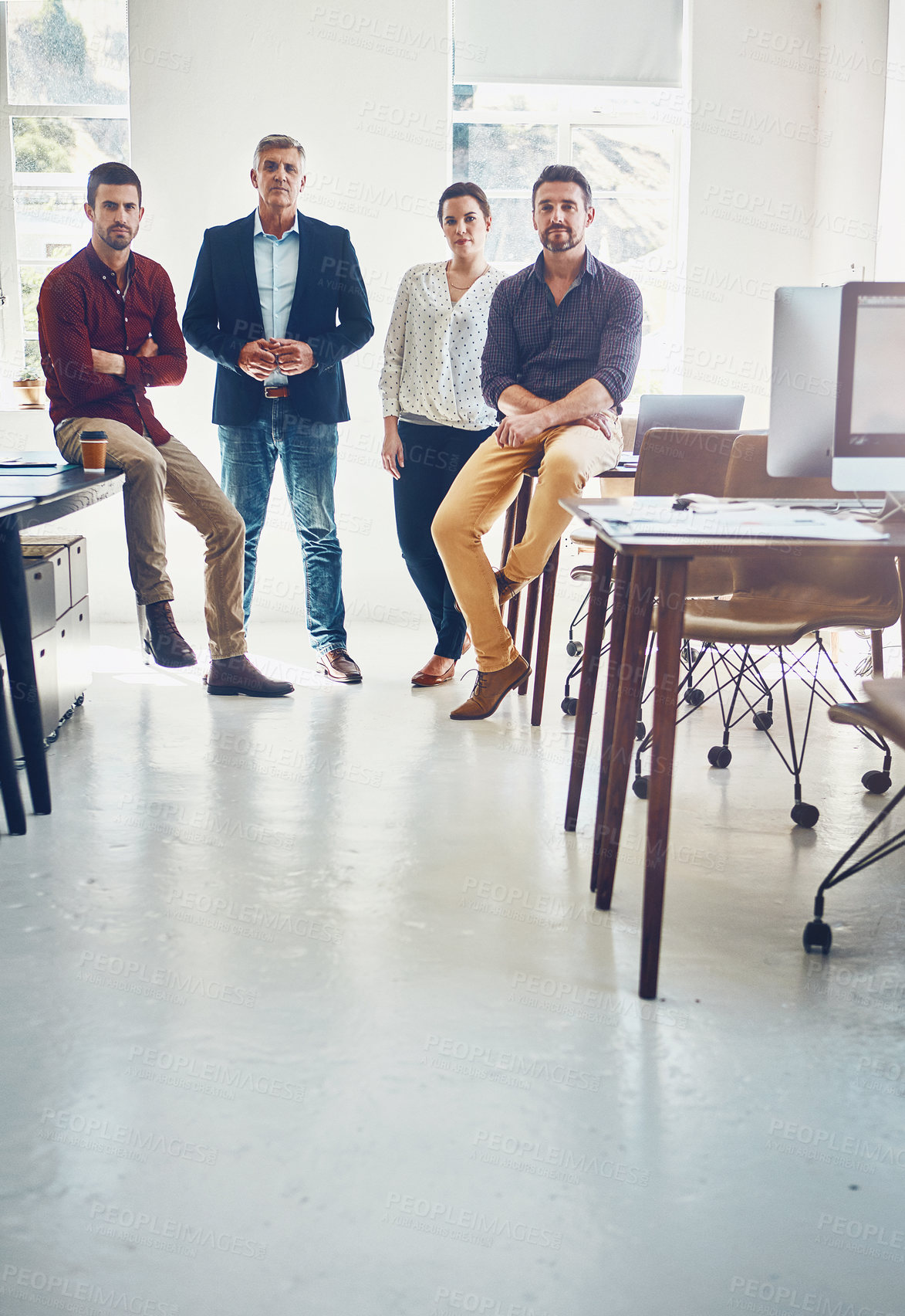 Buy stock photo Portrait of a team of creative workers standing together in an office