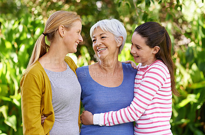 Buy stock photo Shot of three generations of family women standing outdoors