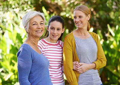 Buy stock photo Shot of three generations of family women standing outdoors
