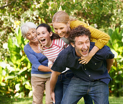 Buy stock photo Family, fun and playing in outdoor nature, love and bonding together or happy in backyard. Generations, smile and laugh or game for humor in garden or park, vacation and summer holiday in France