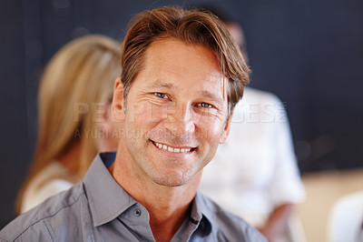 Buy stock photo Man, meeting and portrait for discussion in office, confident and pride for problem solving. Male person, professional and commitment to team communication in workplace, smile and business planning