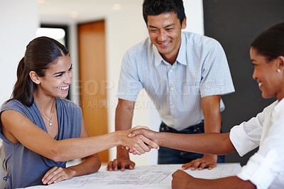 Buy stock photo Architect, smile and handshake of business people for deal, agreement or partnership in startup. Group, designer or shaking hands in meeting for contract, b2b or collaboration on construction project
