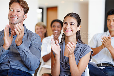 Buy stock photo Shot of a group of coworkers applauding a work seminar