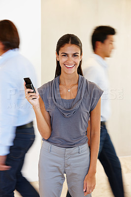 Buy stock photo Businesswoman, portrait and phone with hand in busy office with communication for company with research. Female person, mobile and work with screen for brand, taking and call in profession with tech