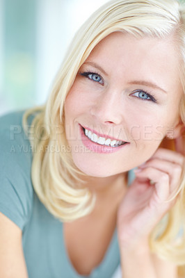 Buy stock photo Cropped portrait of a beautiful blonde woman smiling
