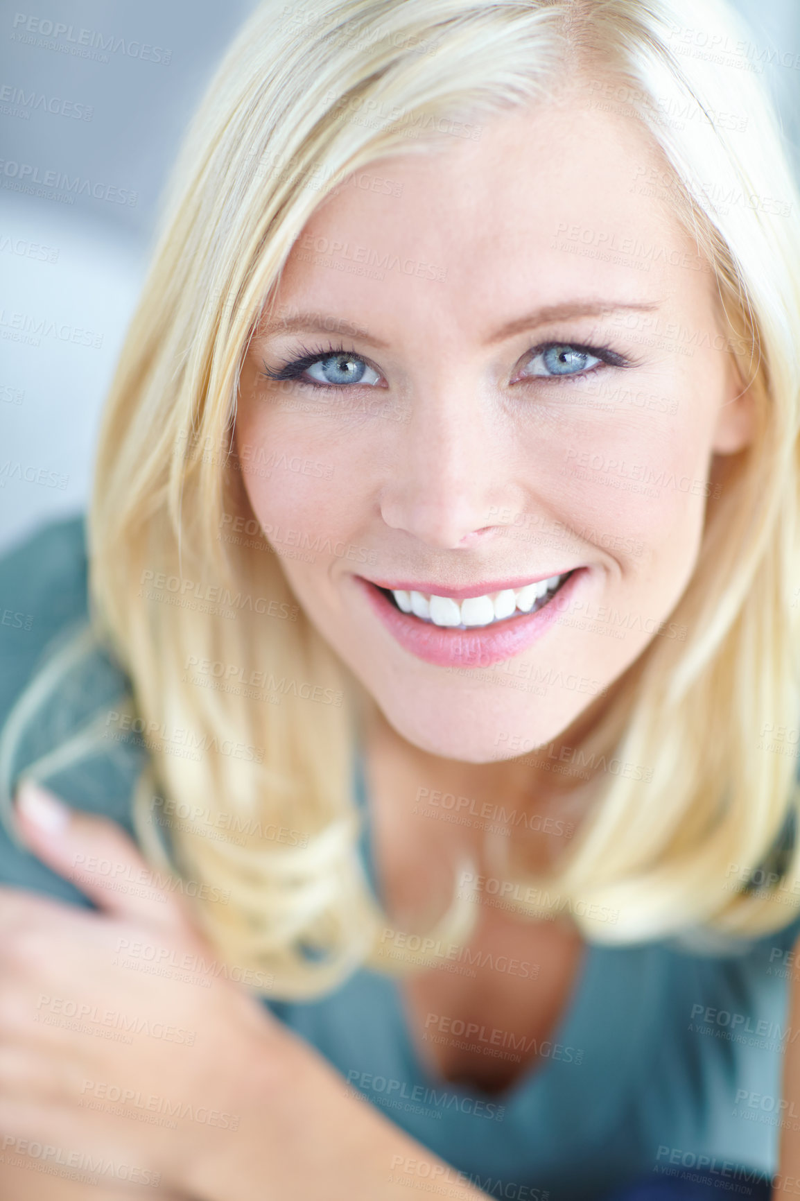 Buy stock photo Cropped portrait of a beautiful blonde woman smiling