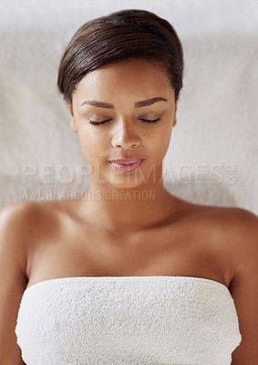 Buy stock photo Black woman, spa and luxury massage in portrait for rest, relax and healthy stress relief. Young, female person and face of model with towel for wellness, muscle therapy and peace at beauty salon