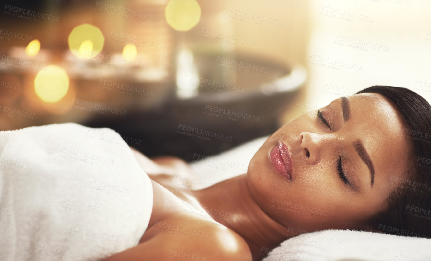 Buy stock photo Woman, spa and relax on massage table or sleep, calm and peaceful on holiday vacation or wellness or hospitality resort. Skincare and therapy for client or body care, eyes closed and town for comfort