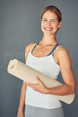 Buy stock photo Happy woman, yoga and portrait smile with mat for exercise, healthy wellness or workout against a grey studio background. Excited female person or yogi smiling for mindfulness, fitness or body health
