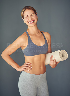 Buy stock photo Happy woman, fitness and yoga mat for exercise, zen workout or healthy body against a grey studio background. Portrait of female person yogi with smile and mat for spiritual wellness or mental health
