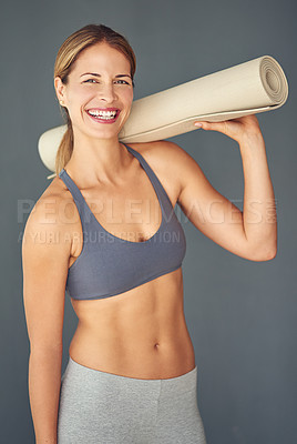 Buy stock photo Happy woman, fitness and portrait smile with yoga mat for workout exercise or healthy body against a grey studio background. Female person or yogi smiling for spiritual wellness, zen or mental health