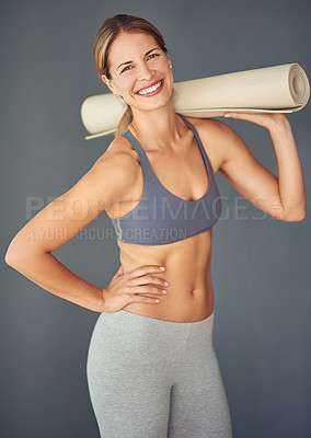 Buy stock photo Happy woman, portrait and yoga mat for zen workout, exercise or healthy body against a grey studio background. Female person or yogi with smile for spiritual wellness, fitness and mental health
