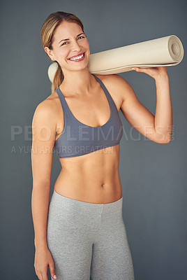Buy stock photo Happy woman, portrait smile and yoga mat for zen workout, exercise or healthy body against a grey studio background. Female person or yogi smiling for spiritual wellness, fitness and mental health