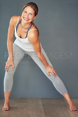 Buy stock photo Shot of a sporty young woman smiling at the camera