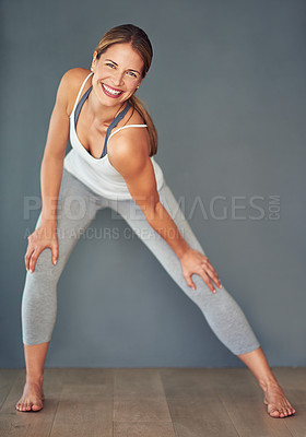 Buy stock photo Fitness, happy woman and warm up in portrait for pilates, yoga class and wellness isolated in studio. Smile, female person or athlete with stretch for cardio exercise preparation on grey background