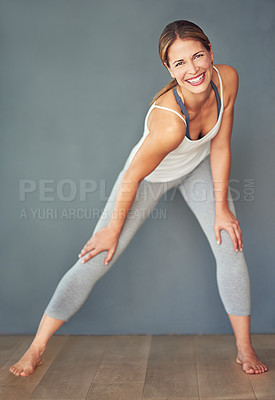 Buy stock photo Fitness, woman and smile with stretch in portrait for yoga, aerobics class and muscle flexibility in studio. Smile, female person or athlete with warm up exercise for balance and cardio preparation