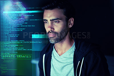 Buy stock photo Shot of a focussed computer hacker using a computer in the dark