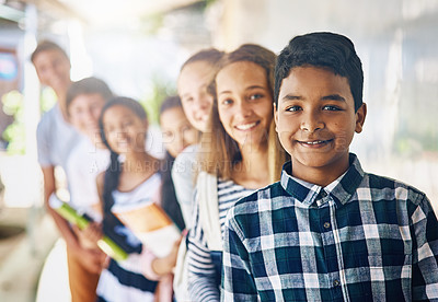 Buy stock photo Portrait of a group of happy schoolchildren standing in a line outside their classroom