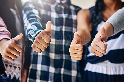 Buy stock photo Shot of a group of unidentifiable schoolchildren showing a thumbs up outside their classroom