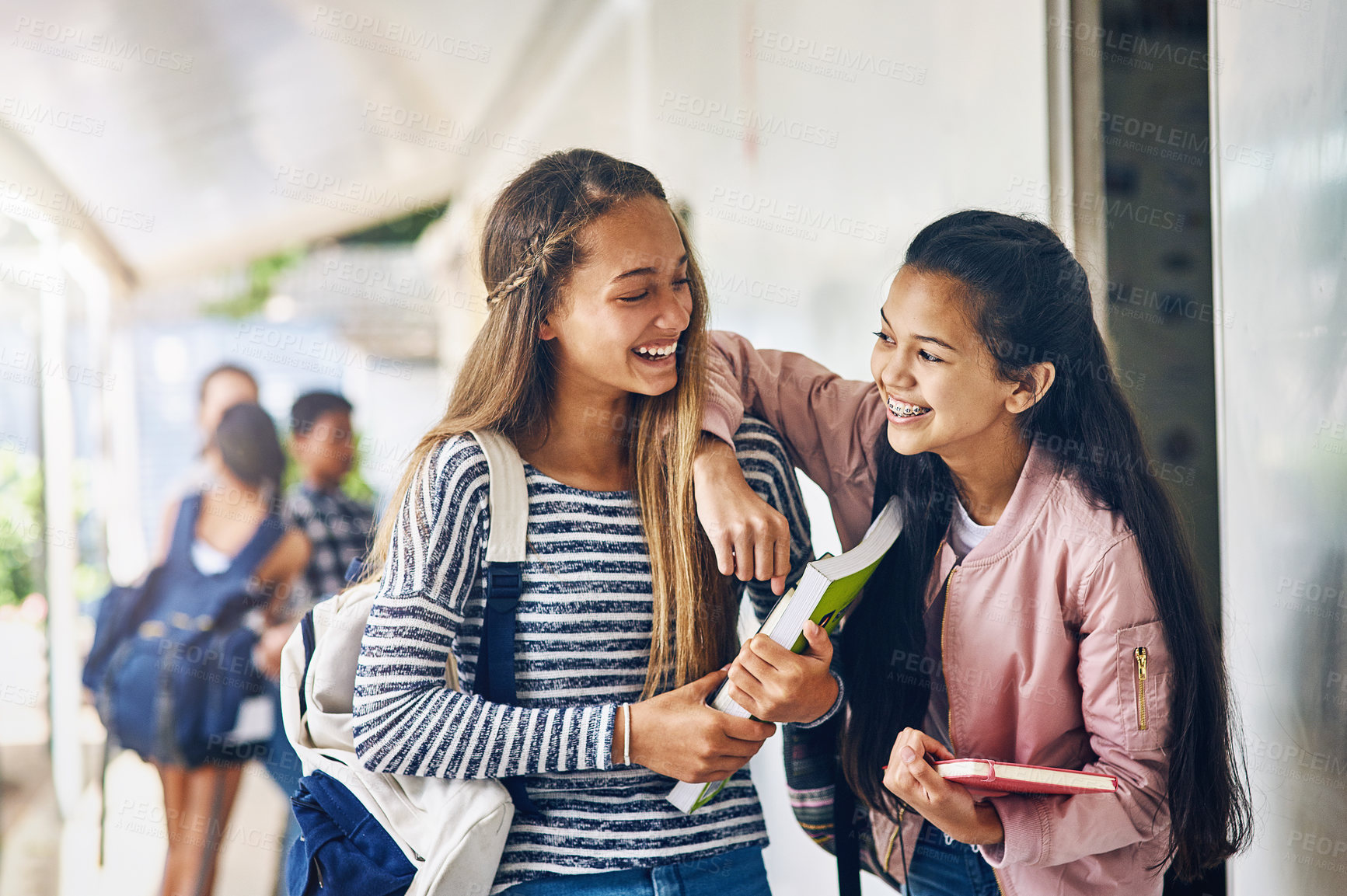 Buy stock photo Girl friends, student and school with laughing and books with smile on campus. Teenager, young teen and girls with happiness and discussion together with education ready to start class and learning
