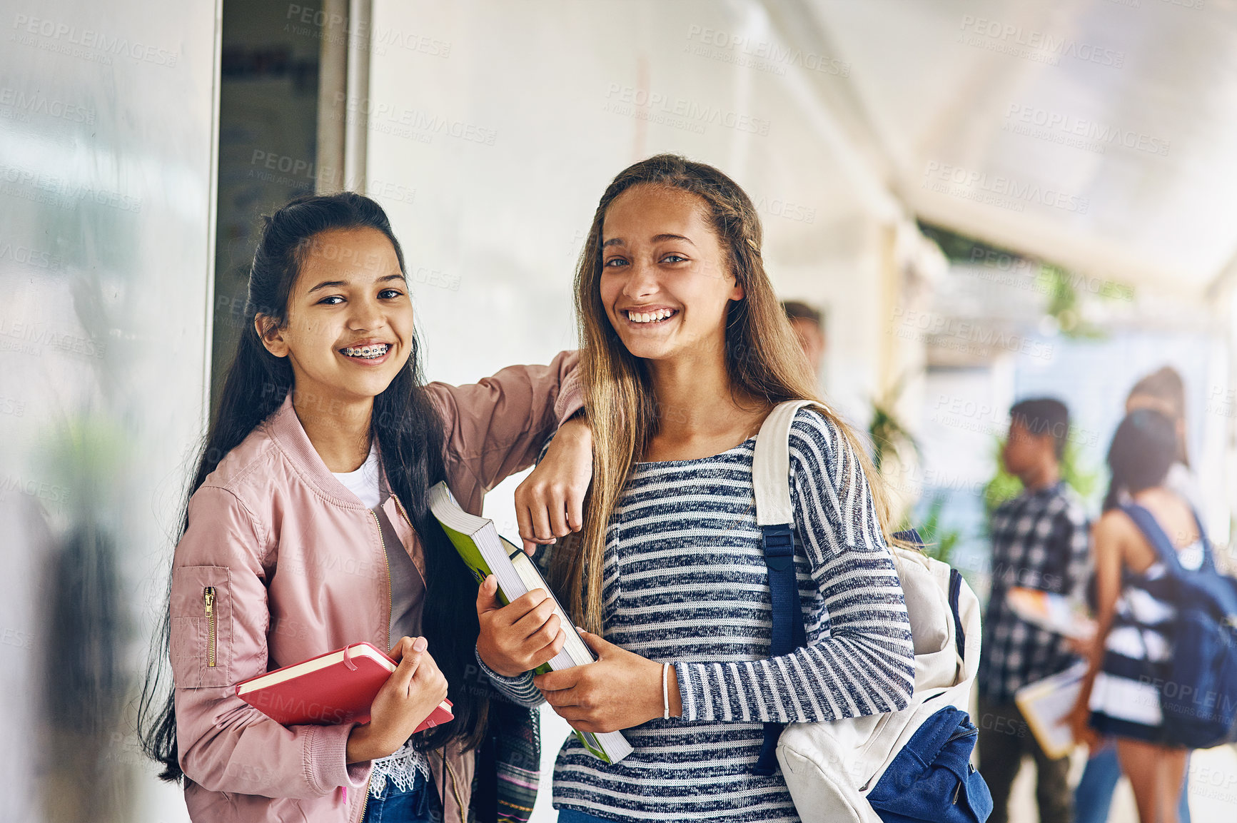 Buy stock photo Girl friends, student portrait and school with learning books, study and smile on campus. Teenager, young teen and girls with happiness and happy together with textbook ready to start education class