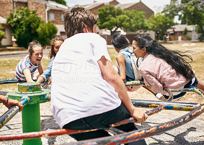 Buy stock photo Shot of a group of happy schoolchildren playing together in the playground