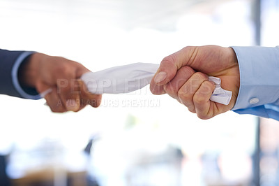 Buy stock photo Cropped shot of two businessmen fighting over a crumpled up document