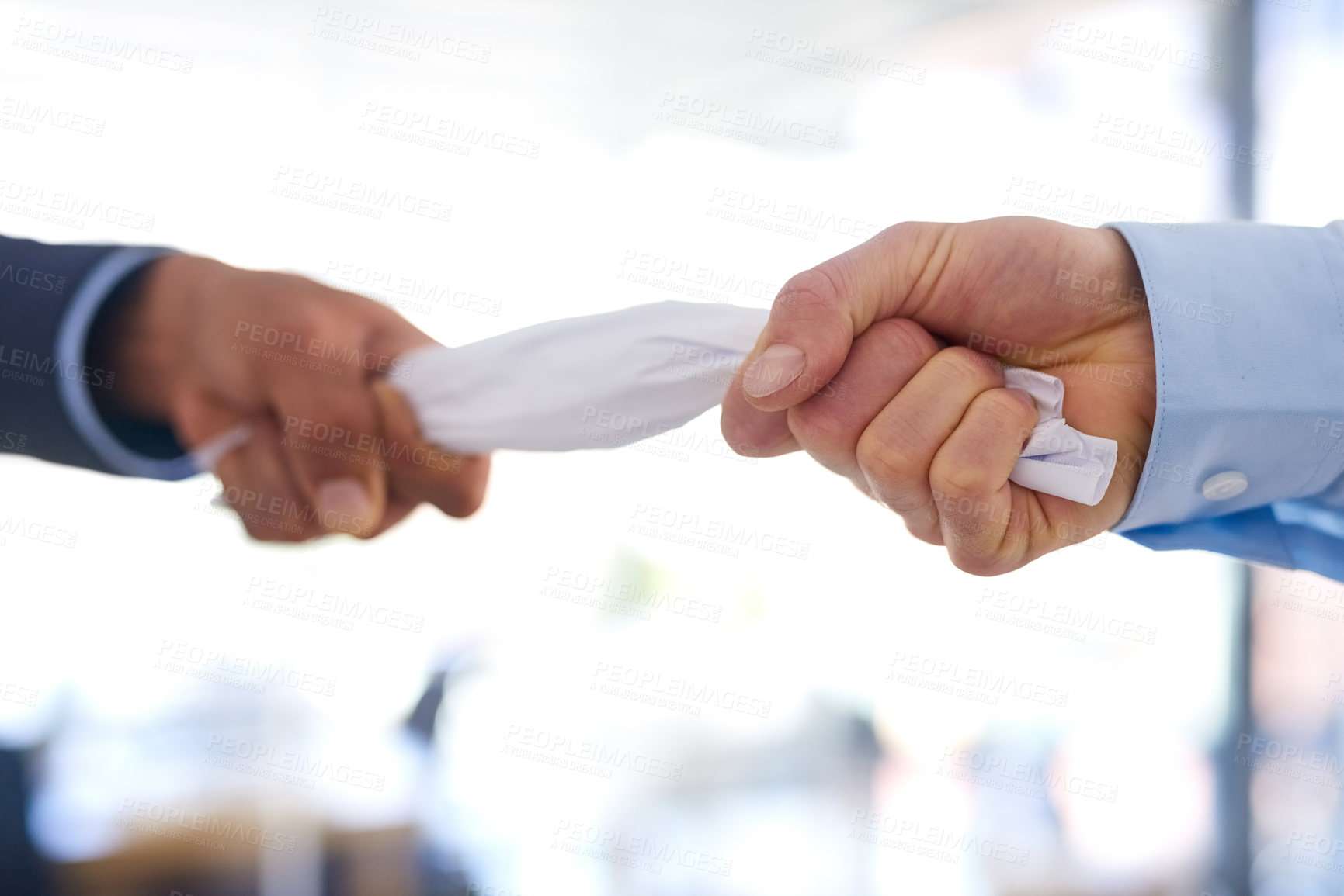 Buy stock photo Cropped shot of two businessmen fighting over a crumpled up document