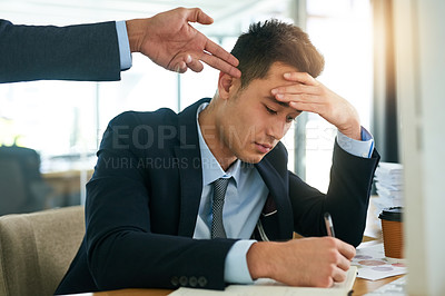 Buy stock photo Shot of a young businessman working while his boss gestures a finger gun to his head