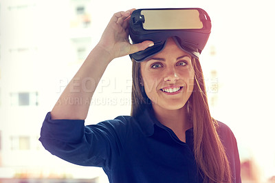 Buy stock photo Portrait of a young businesswoman wearing a VR headset in an office