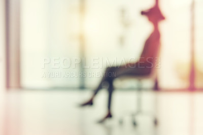 Buy stock photo Defocused shot of a young businesswoman wearing a VR headset in an office
