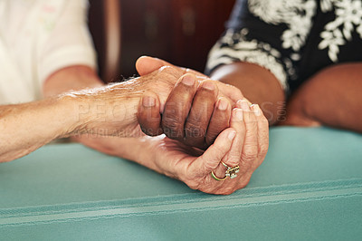 Buy stock photo Cropped shot of a senior woman holding her friend’s hands in comfort