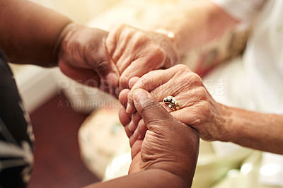 Buy stock photo Cropped shot of a senior woman holding her friend’s hands in comfort