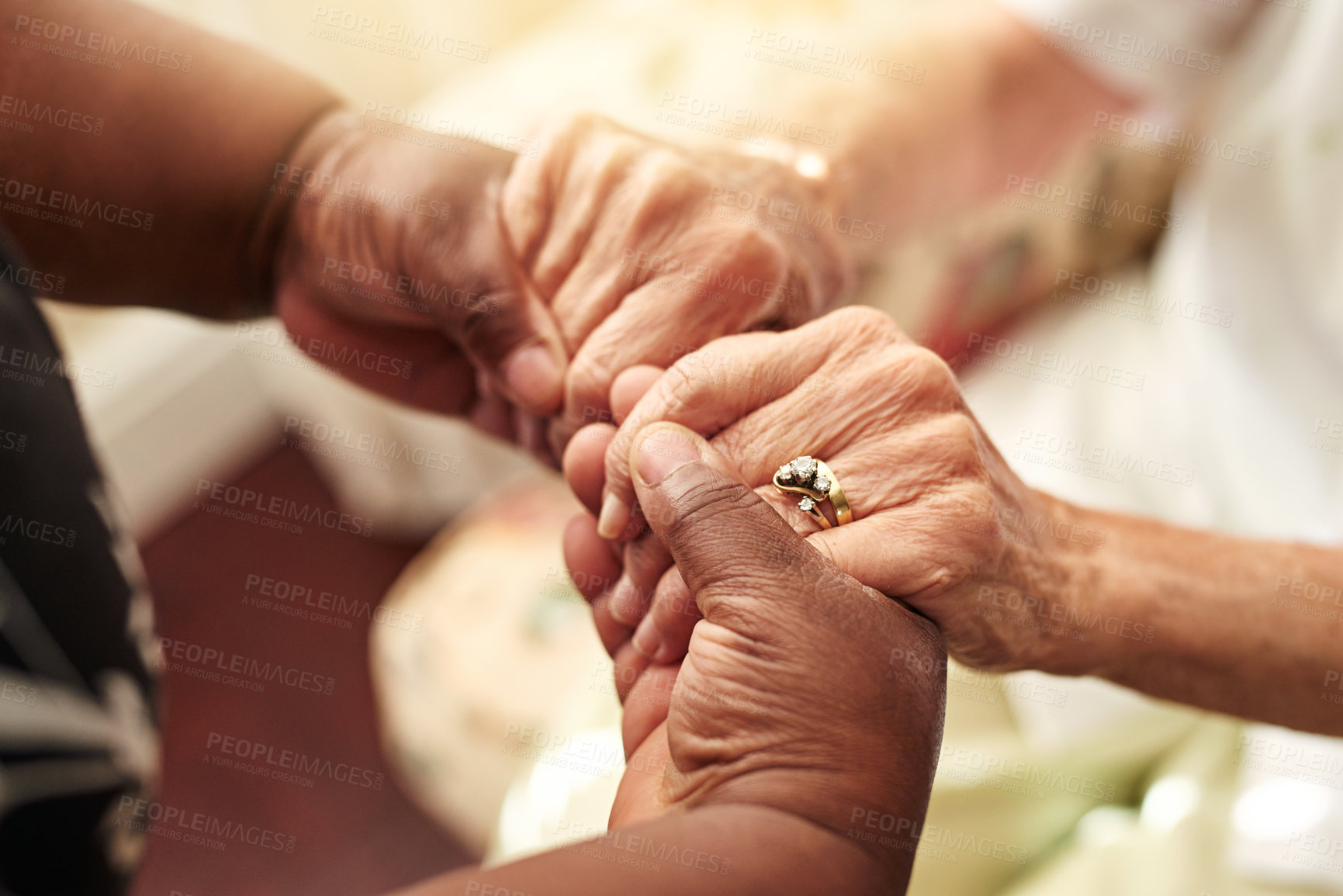 Buy stock photo Cropped shot of a senior woman holding her friend’s hands in comfort