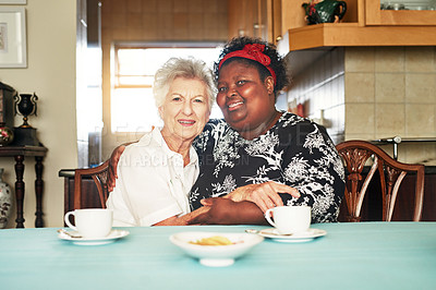 Buy stock photo Portrait, senior woman and caregiver at kitchen table for relax, morning tea or happiness in home. Visit, hug and elderly person with volunteer friend for conversation, care or bonding together