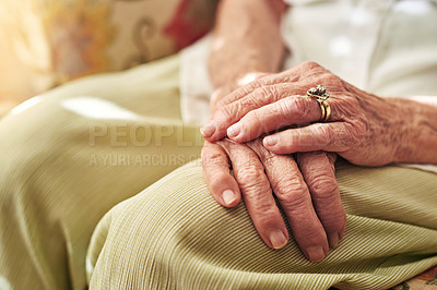 Buy stock photo Closeup, sofa and hands of elderly woman in retirement home for thinking, reflection and nostalgia in house. Old age, living room and senior person on couch for relaxing, calm and peace in morning