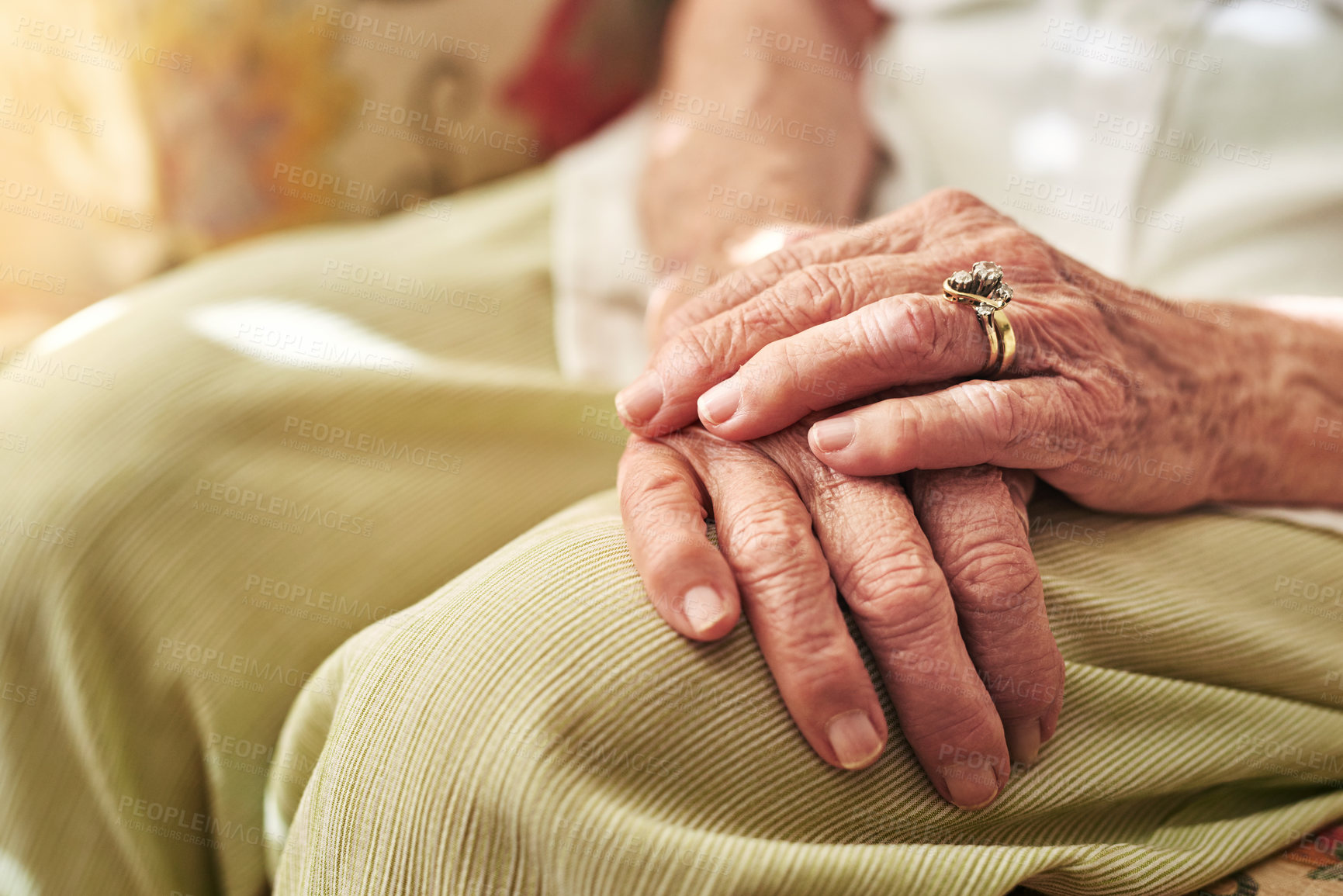 Buy stock photo Closeup, sofa and hands of elderly woman in retirement home for thinking, reflection and nostalgia in house. Old age, living room and senior person on couch for relaxing, calm and peace in morning