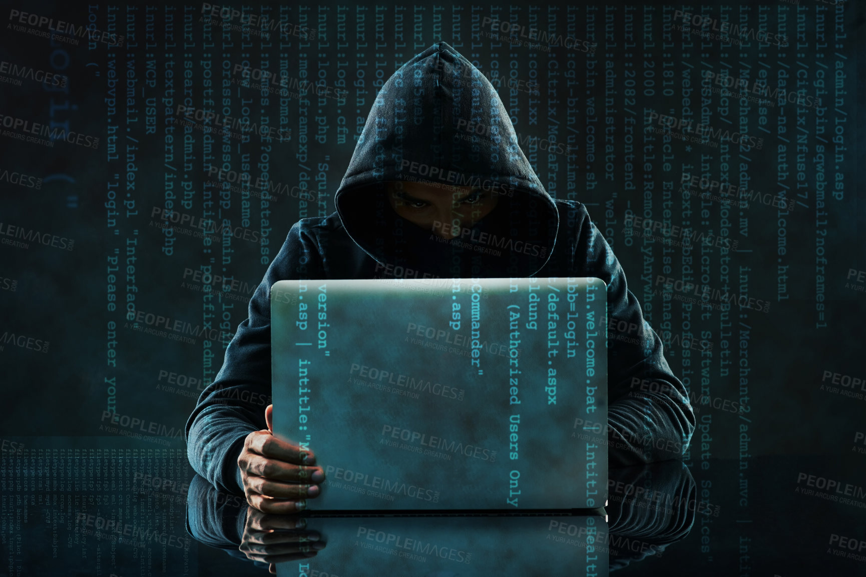 Buy stock photo Shot of an unidentifiable computer hacker using a laptop against a dark background in studio