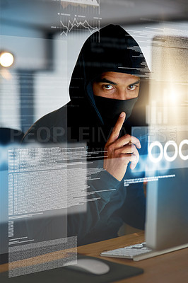 Buy stock photo Portrait of a serious computer hacker hacking into a computer in an office