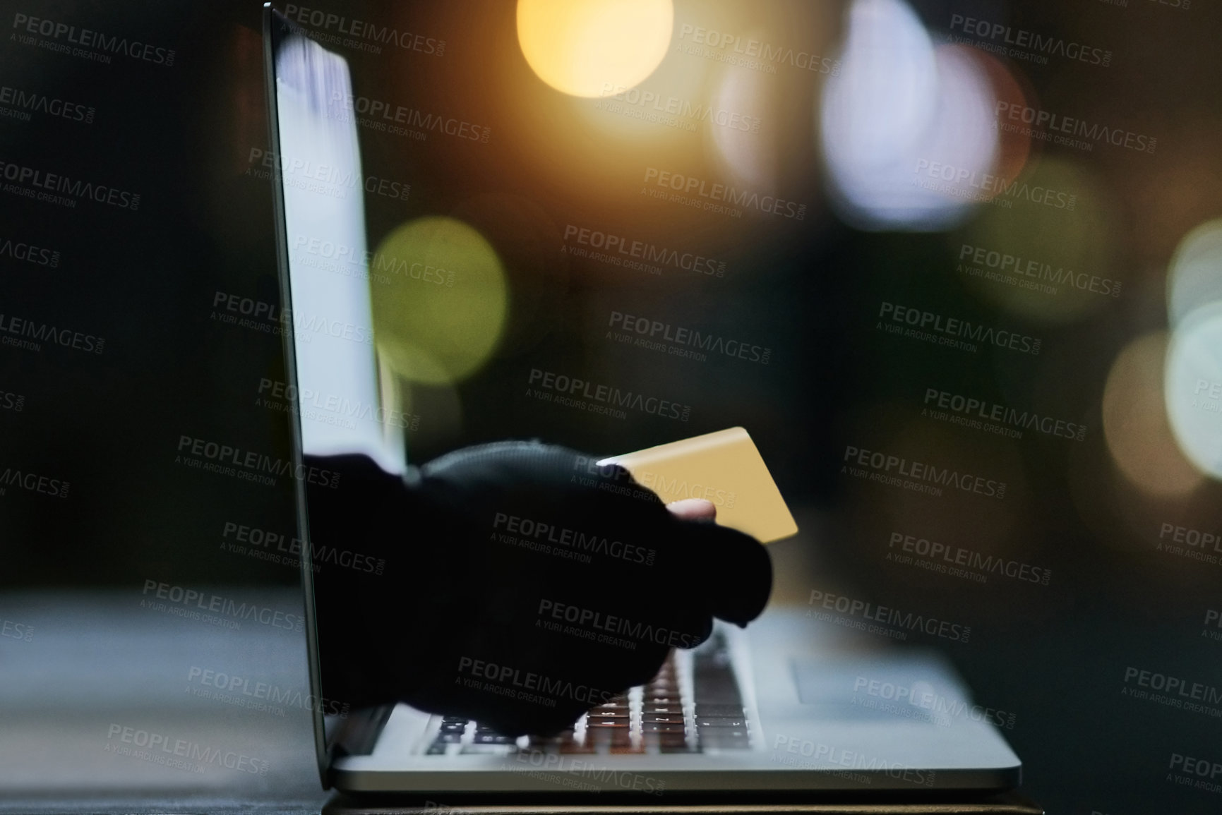 Buy stock photo Shot of a disembodied hand reaching through a laptop screen to steal a credit card