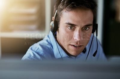 Buy stock photo Telemarketing agent, focus and man consulting with advice, sales or help desk worker with headset. Phone call, conversation and customer support consultant, crm service agency listening on headphones