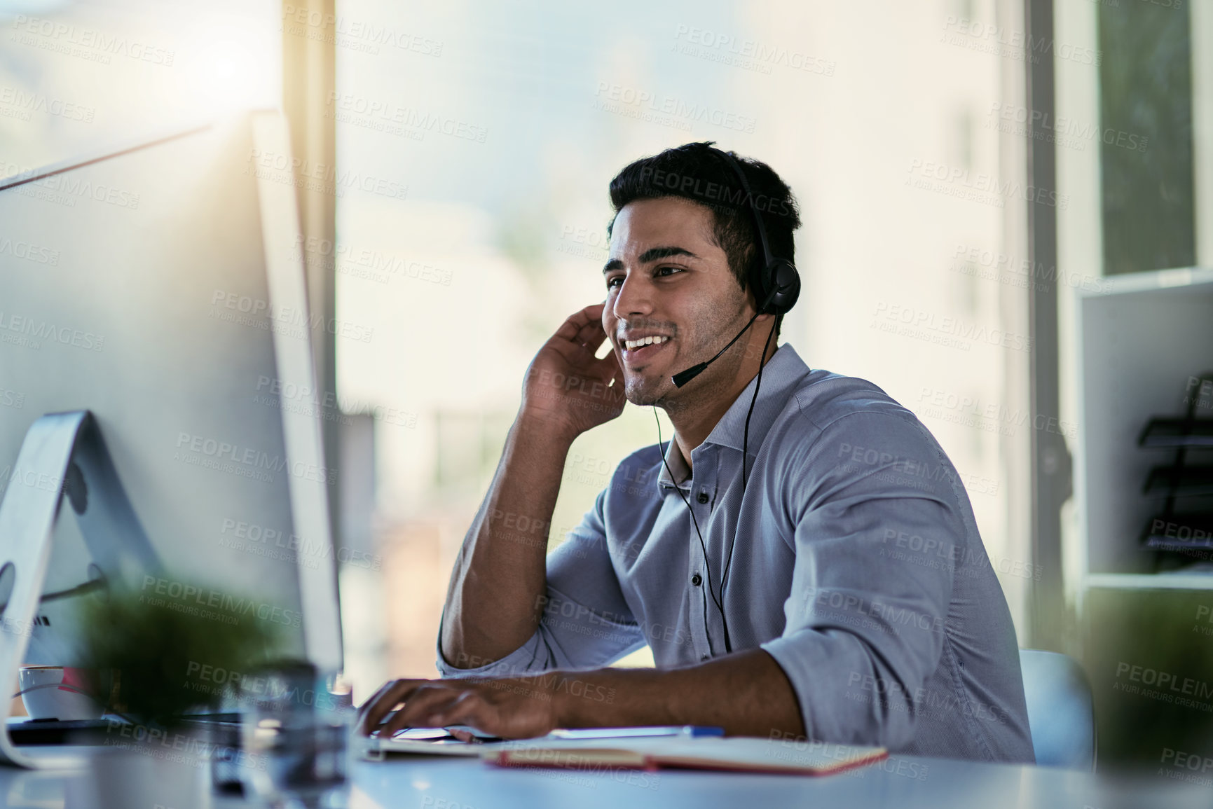 Buy stock photo Cropped shot of a call centre agent working in an office