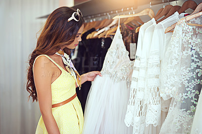 Buy stock photo Cropped shot of an attractive young woman searching for a wedding dress